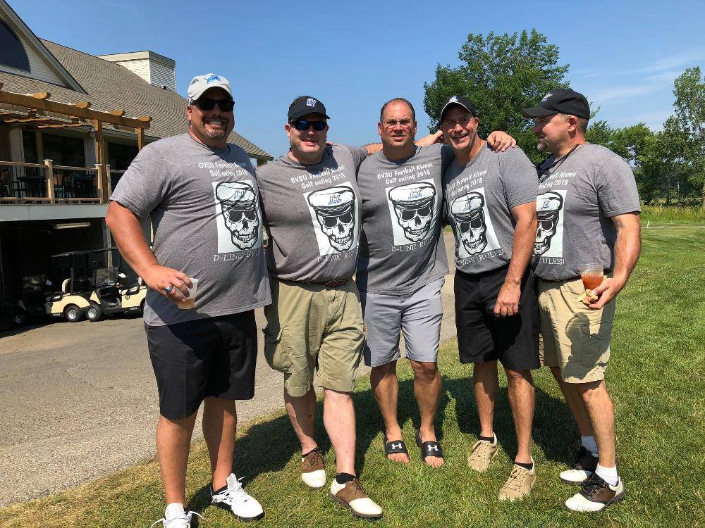 5 men in grey ts